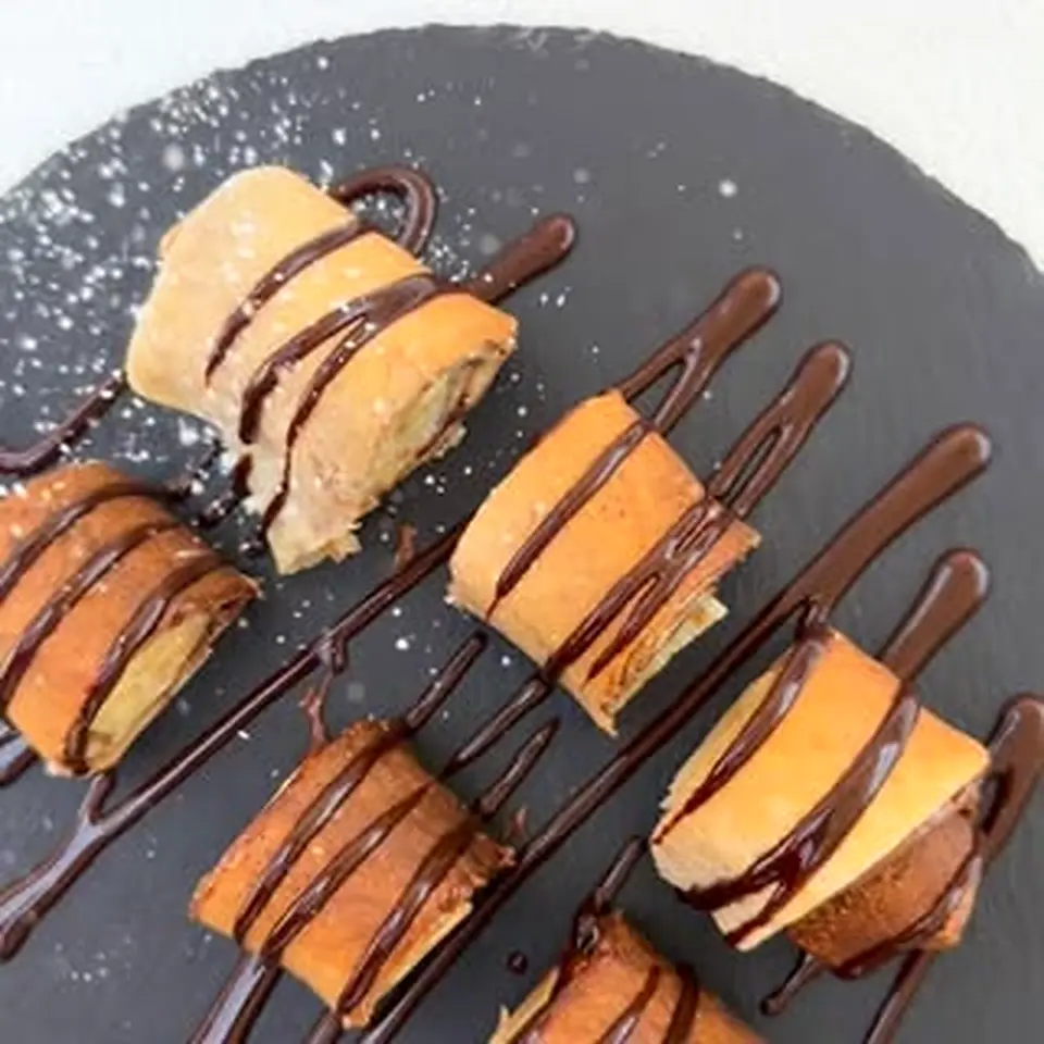Afzim Cafe pastries with chocolate drizzle